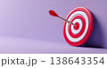 Hand holding a red target with an arrow hitting the center. Target audience, marketing strategy, customer focus, and human resources in business and innovation. Goal achievement. Aiming. Planning 138643354