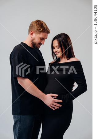 Couple happily awaiting a new arrival in cozy studio 138644108