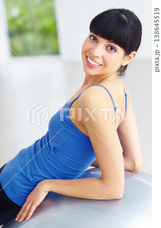 Exercise ball, pilates portrait and happy woman relax after yoga routine, fitness or wellness workout. Happiness, smile and studio person rest after sports training, aerobics or cardio challenge 138645519