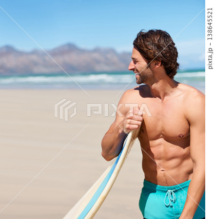 Surfing, fitness and happy man at a beach with surfboard for training, hobby or fun in nature. Water, sports and male surfer relax at the sea for travel, freedom and adventure workout in Hawaii 138645521