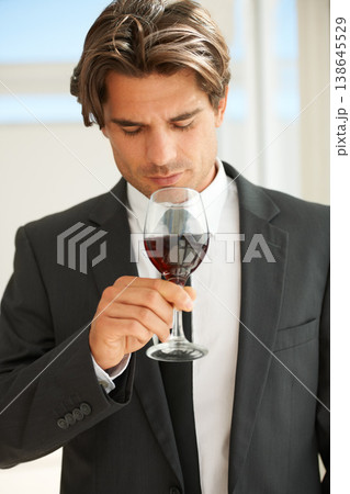 Glass of red wine, glass and man with promotion, thinking and celebration with event, aroma and suit. Rich, guy and expert with alcohol, idea and luxury with beverage, drink and winery with scent 138645529