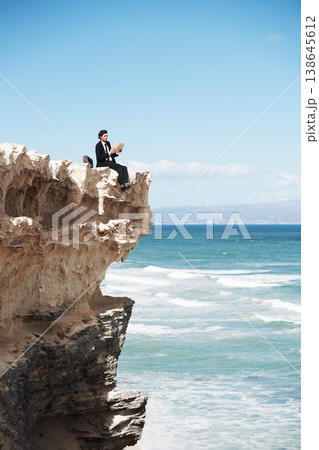 Reading, cliff and business man by ocean for freedom, holiday and vacation to relax in nature. Professional, mockup and corporate worker on rocks with book for calm mindset, ideas and future goals Reading, cliff and business man by ocean for freedom, holiday and vacation to relax in nature. Professional, mockup and corporate worker on rocks with book for calm mindset, ideas and future goals 138645612