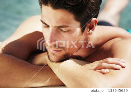 Sleeping, tanning and a man in the sun to relax, swimming or thinking on a vacation. Calm, summer and a young person enjoying peace, break or pool in Greece on a holiday with an idea in the water Sleeping, tanning and a man in the sun to relax, swimming or thinking on a vacation. Calm, summer and a young person enjoying peace, break or pool in Greece on a holiday with an idea in the water 138645629