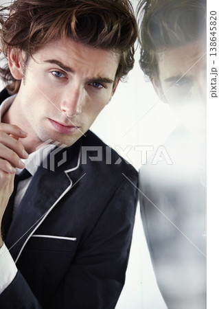 Serious, fashion and portrait of young man with double exposure for formal, classy or cool outfit. Confidence, smirk and handsome male model with elegant blazer for style by studio background. Serious, fashion and portrait of young man with double exposure for formal, classy or cool outfit. Confidence, smirk and handsome male model with elegant blazer for style by studio background. 138645820
