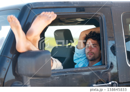 Road trip, man or feet on window of car for relax, peace and adventure with travel or destination. Person, tourist or traveler with chilling in van on vacation, holiday or traveling journey in nature Road trip, man or feet on window of car for relax, peace and adventure with travel or destination. Person, tourist or traveler with chilling in van on vacation, holiday or traveling journey in nature 138645833