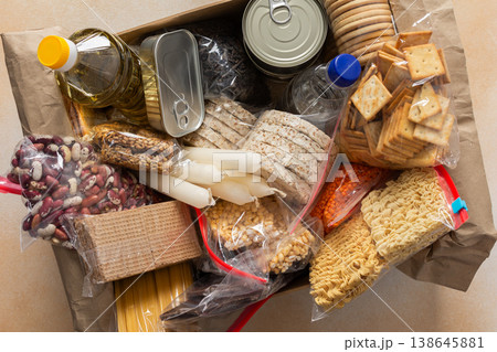 Canned goods, cereals, and pasta stored for quarantine and isolation, ensuring long-term survival and food security at home, survival during military operations, the concept of stay at home 138645881