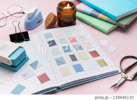 Creating cute scrapbook embellishments with paper punches and colorful patterns Creating cute scrapbook embellishments with paper punches and colorful patterns 138646110