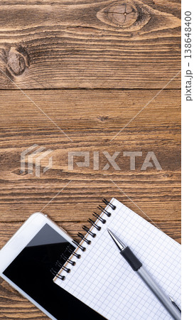 Workspace vertical with smartphone notebook Workspace vertical with smartphone notebook 138648400