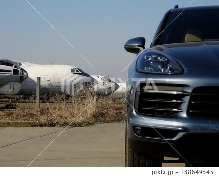 White aircrafts behind the passenger vehicle at the airport  138649345