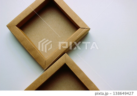 Craft Paper Boxes Lie on a White Surface Tightly Pressed Against Each Other 138649427