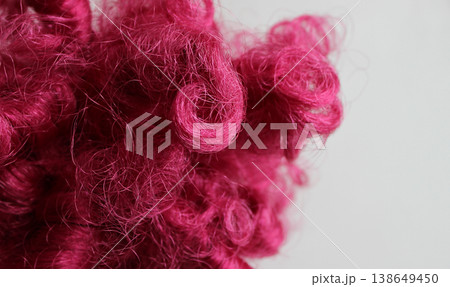 Macro shot of chaotically intertwined pink thread-like fibers Macro shot of chaotically intertwined pink thread-like fibers 138649450