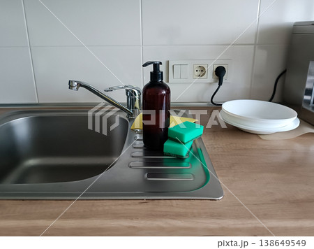 Kitchen Sink Setup with Soap and Sponges Kitchen Sink Setup with Soap and Sponges 138649549