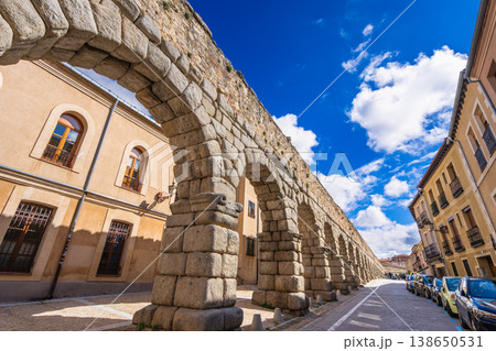 Ancient Roman Aqueduct of Segovia, Spain under a Bright Blue Sky 138650531