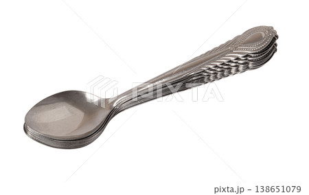 Stacked shiny stainless steel spoons on transparent background 138651079