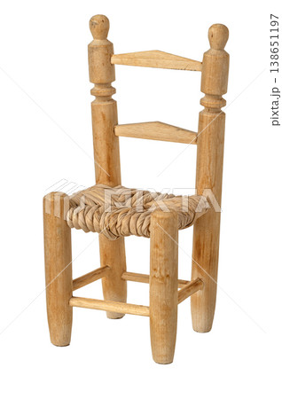Small wooden chair with woven fiber seat on white Small wooden chair with woven fiber seat on white 138651197