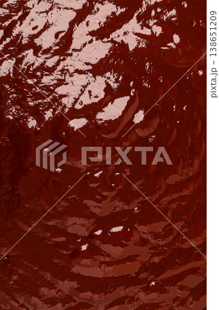 Viscous brown liquid flowing glossy abstract background texture 138651209
