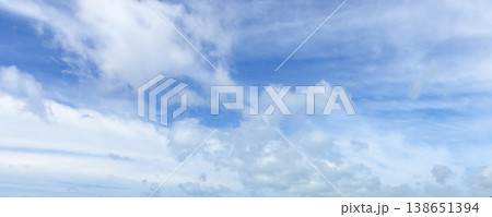Panoramic blue sky background featuring white clouds formation Panoramic blue sky background featuring white clouds formation 138651394