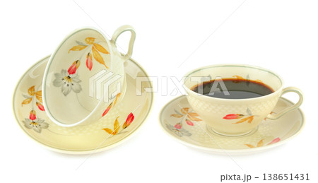 Vintage Porcelain Tea Cups with Floral Pattern on White Background 138651431