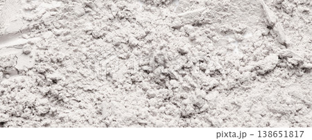 The texture of white cosmetic clay. The concept of cosmetic procedures or mud treatment. The texture of white cosmetic clay. The concept of cosmetic procedures or mud treatment. 138651817
