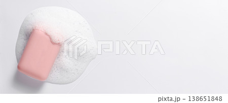 Pink soap with foam on a white background. Copy space 138651848