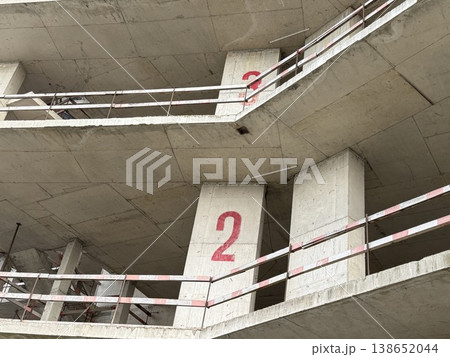 Construction site concrete structure with number two, illustrating industrial architecture elements Construction site concrete structure with number two, illustrating industrial architecture elements 138652044