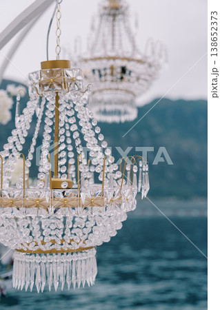 Magnificent Glass Lighting Fixtures Suspended Above Still Waters Create Aura Of Elegance And Purity Magnificent Glass Lighting Fixtures Suspended Above Still Waters Create Aura Of Elegance And Purity 138652373