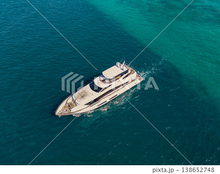 Luxury yacht boat top view. Panorama aerial view on motorboat. Motor boat yacht floating to marina. Motorboat tour by summer sea. Luxury yacht boat at sea. Summer vacation. Yacht club Luxury yacht boat top view. Panorama aerial view on motorboat. Motor boat yacht floating to marina. Motorboat tour by summer sea. Luxury yacht boat at sea. Summer vacation. Yacht club 138652748