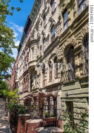 New york, usa august 14,2024. Classic new york city brownstone residential buildings with ornate architecture on a sunny day in the upper west side, manhattan New york, usa august 14,2024. Classic new york city brownstone residential buildings with ornate architecture on a sunny day in the upper west side, manhattan 138654001