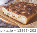 Freshly baked homemade cheesy garlic bread with a golden crispy crust resting on parchment paper. Cozy meal concept 138654202