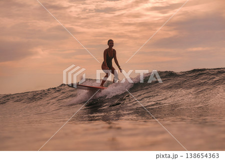 Wave Rider Supports Environmental Awareness During Evening Sunset 138654363