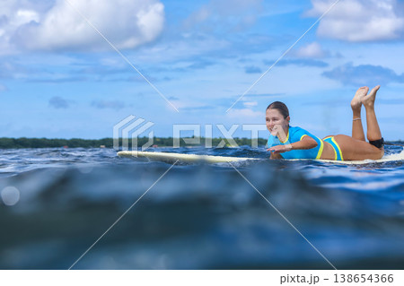Young Woman Floating On Gentle Seas During Quiet Retreat 138654366