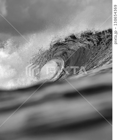 Close Perspective Revealing Textured Spray And Foam On Powerful Wave 138654369