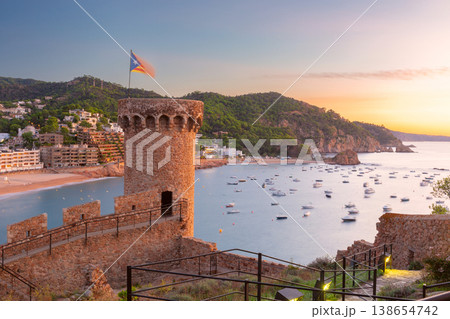 Watchtower and bay at sunset in Tossa de Mar, Costa Brava, Spain Watchtower and bay at sunset in Tossa de Mar, Costa Brava, Spain 138654742