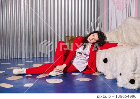 Artistic representation of confident performer next to cozy polar display 138654996