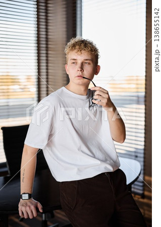 Young person thinking in contemporary home office space Young person thinking in contemporary home office space 138655142