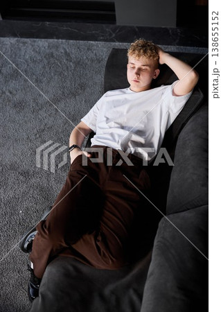 Confident male innovator smiling peacefully in modern lounge 138655152