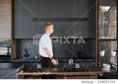 Peaceful indoor environment with individual preparing beverages Peaceful indoor environment with individual preparing beverages 138655154