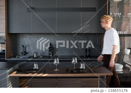 White male interior designer inspecting modern kitchen White male interior designer inspecting modern kitchen 138655176