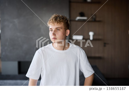 Youthful female model staring directly into camera with intense gaze 138655187