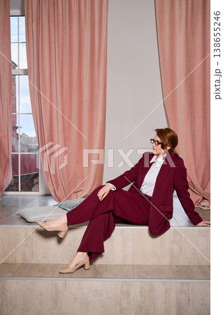 Elegant Caucasian woman providing friendly guidance at window Elegant Caucasian woman providing friendly guidance at window 138655246