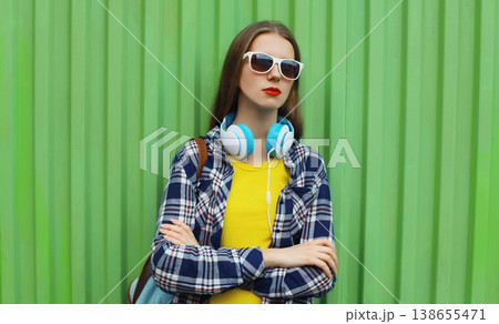 young woman listening to music, girl with headphones young woman listening to music, girl with headphones 138655471