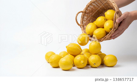 Hands pouring lemons out of a wicker basket with vitamin c white background food photography still life spilling vitamin c ingredients beverage refreshing isolated copy space abundance Hands pouring lemons out of a wicker basket with vitamin c white background food photography still life spilling vitamin c ingredients beverage refreshing isolated copy space abundance 138657717