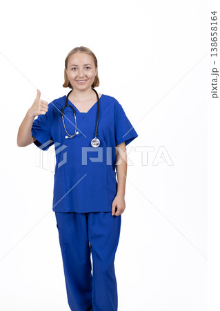 Happy female doctor showing a thumbs up Happy female doctor showing a thumbs up 138658164