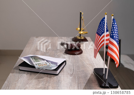 American flags and legal gavel on office desk American flags and legal gavel on office desk 138658785