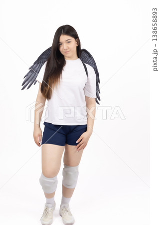 Young woman with angel wings posing on white background 138658893