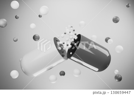 Black and white medicine capsule breaking into particles 138659447