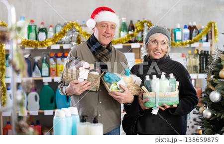 Couple man and woman choosing cosmetics gift set for christmas Couple man and woman choosing cosmetics gift set for christmas 138659875