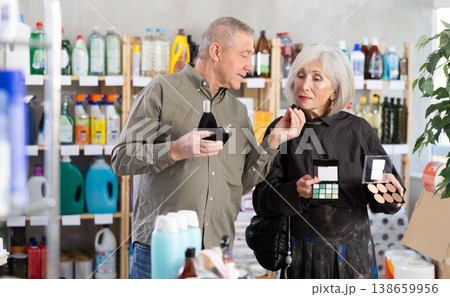 Husband and wife choose cosmetics and perfume together in supermarket 138659956