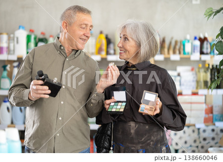 Husband and wife choose cosmetics and perfumes in the supermarket Husband and wife choose cosmetics and perfumes in the supermarket 138660046