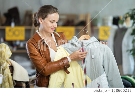 Woman choosing a jacket for autumn 138660215